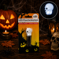 Weißes schädel-förmiges led-flaschenkorken mit schwarzer basis in halloween-verpackung für partydeko