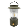 Laterne warmweiß dimmbar in matt oliv mit klarem glas, schwarzem griff und goldfarbenem knauf, 24x9 cm