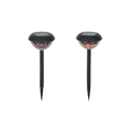 Zwei schwarze solar-gartenlampen mit 360 grad muster und leuchtenden lächelnden gesichtern