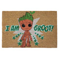 Braune coir fußmatte mit cartoon-groot motiv, grünen haaren und augen, umgeben von türkisfarbenen sternen und text i am groot