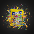 A vibrant yellow maoam partymix 325g bag filled with colorful candy wrappers and confetti bursting out
