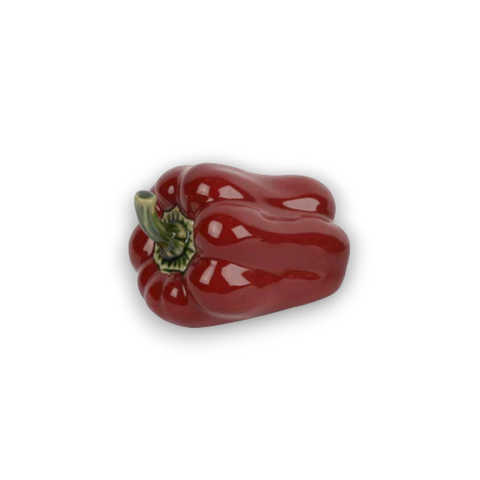 Glänzende rote porzellan paprika mit grünem stiel und geriffelter oberfläche als dekorative keramik