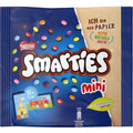 Ein lebhaft blau-beiges nestlé smarties minis 158g paket voller bunter runder schokolinsen