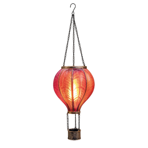 Ein solar luftballon mit flammeneffekt mit 20 led in rosa und einem leuchtend roten lampionkorb aus geflochtenem material