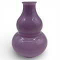 Glänzende lila doppelkürbis-vase mit glatter reflektierender oberfläche aus keramik für die raumdekoration