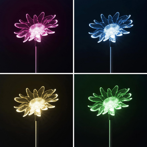 Transluzente glas-solarlampe in blumenform mit schlankem metallschaft in pink, blau, gelb und grün wechselndes licht