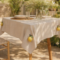 Beige leinentischdecke mit bestickten gelben zitronen und grünen blättern tischdeckengewicht zitrone
