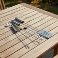 Set aus 3 verchromten grillbesteckteilen aus edelstahl mit polierten griffen und funktionalem design