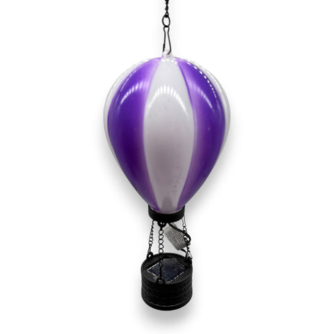 Led solar heißluftballon mit flackereffekt in lila-weiß gestreift und schwarzem metallkorb als gartenleuchte