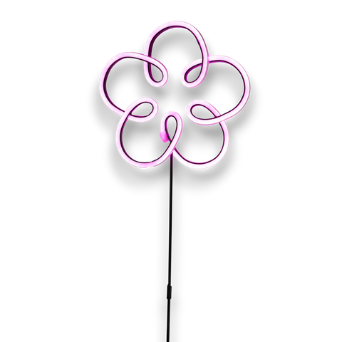 Ein leuchtendes rosa neonblumenschild mit schlankem stiel für den außenbereich gartenstab