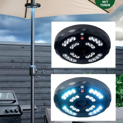 Schwarze led sonnenschirm beleuchtung mit mehreren hellen birnen in konzentrischen kreisen und rotem stromanzeiger