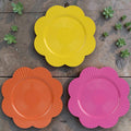 Vibrante teller blume 33 cm aus kunststoff in gelb orange und pink mit sonnenschein muster