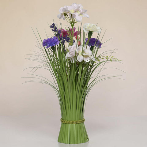 Eine künstliche gras blütenmischung lila pink mit weißen, lila und pinken blüten und grünen grasstielen