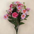 A vibrant bouquet pink mix with artificial pink and white roses daisies with yellow centers and green foliage