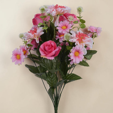 A vibrant bouquet pink mix with artificial pink and white roses daisies with yellow centers and green foliage